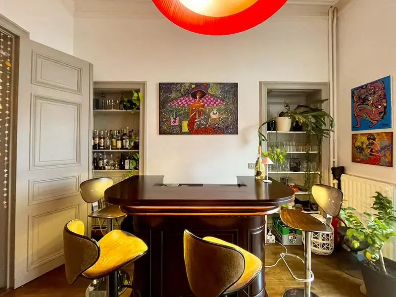 The bar at Villa O with yellow stools